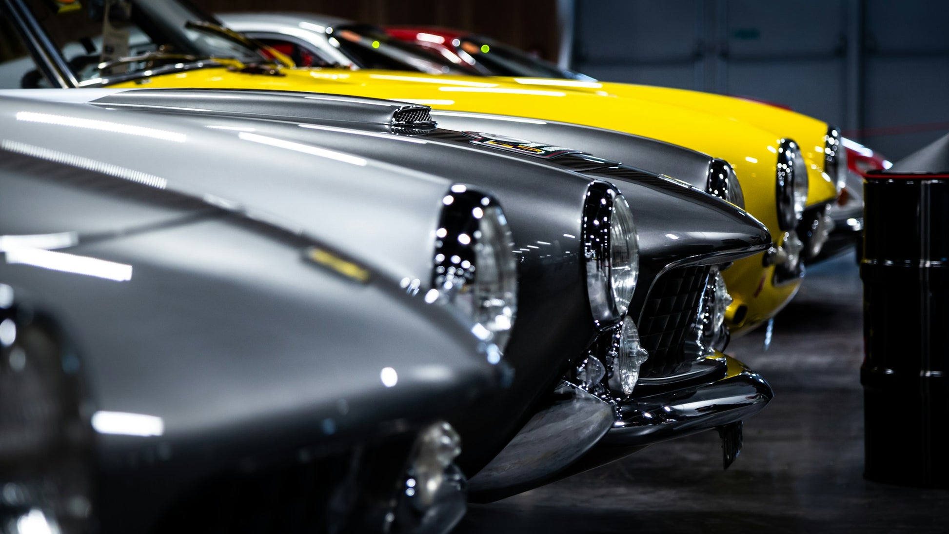Close-up of vintage cars with a focus on chrome details.